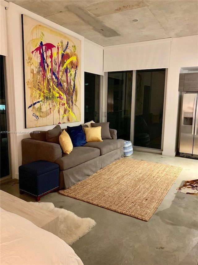 living room featuring concrete flooring