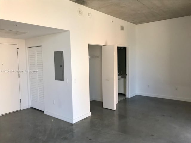 unfurnished bedroom featuring electric panel