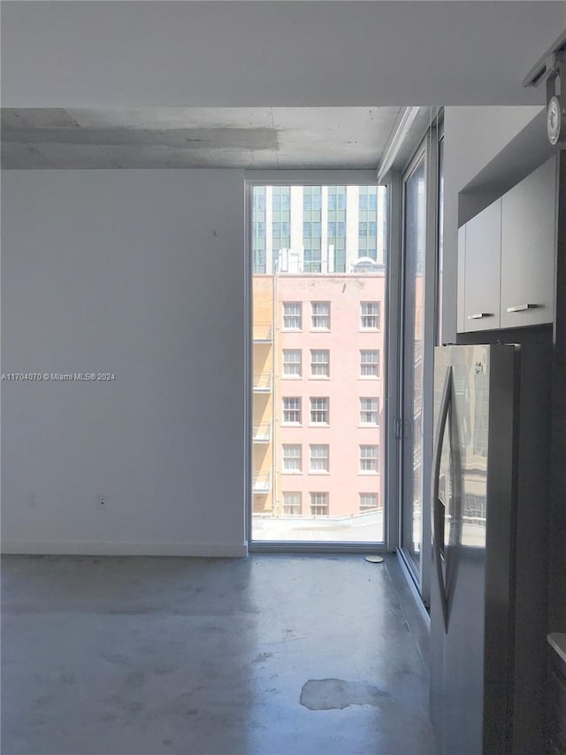 spare room featuring concrete floors