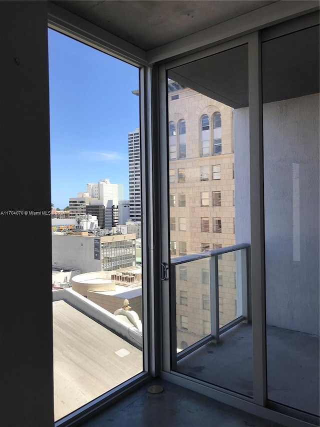 entryway with expansive windows and concrete flooring