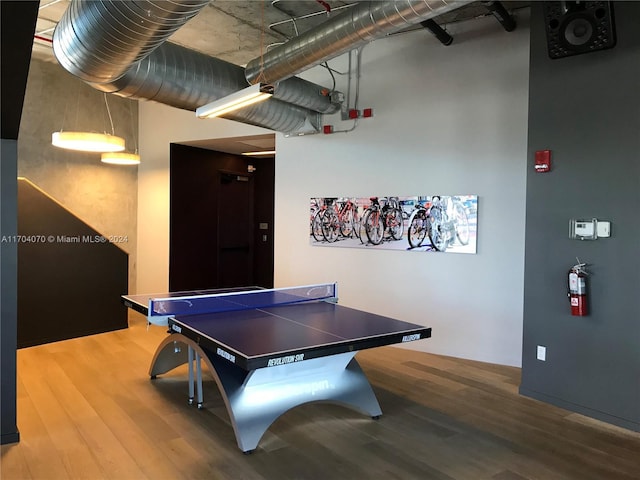 recreation room with wood-type flooring