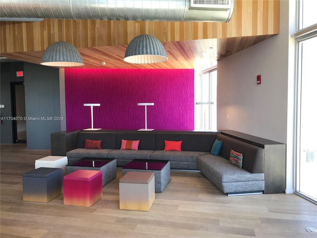 living room featuring hardwood / wood-style floors and a high ceiling