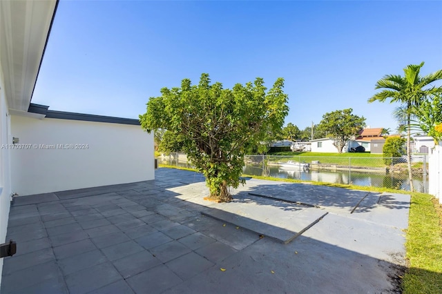 view of patio featuring a water view