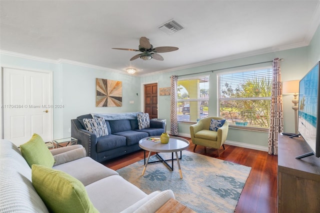 living room with dark hardwood / wood-style floors, ceiling fan, and crown molding