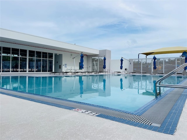 view of swimming pool with a patio