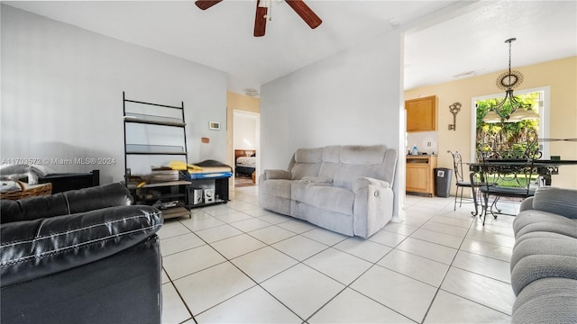 living room with ceiling fan and light tile patterned floors