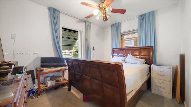 bedroom with ceiling fan and cooling unit