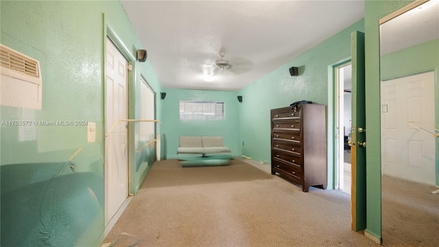 unfurnished room with ceiling fan and light colored carpet