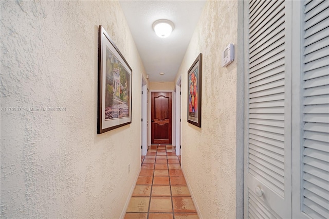 hallway with light tile patterned floors