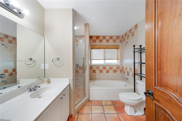 full bathroom with vanity, separate shower and tub, and toilet