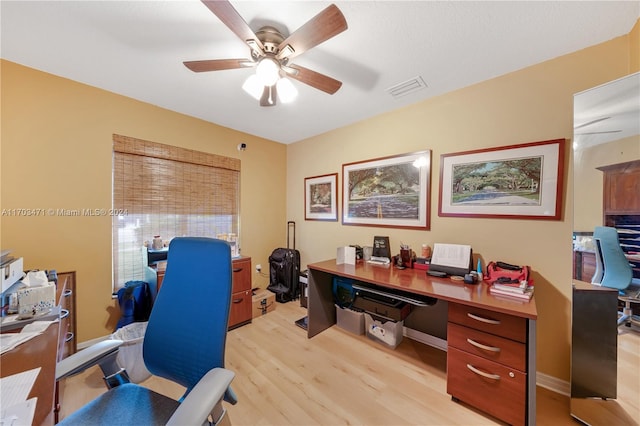 office space with light hardwood / wood-style flooring and ceiling fan