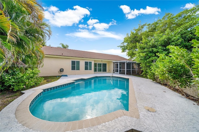 view of pool with a sunroom