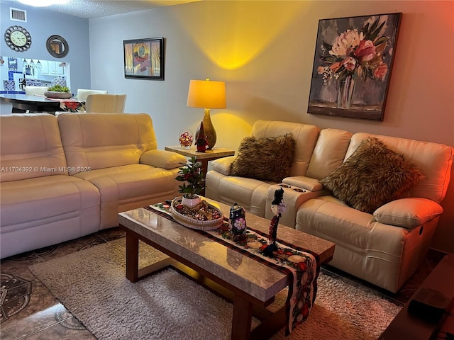 living room with a textured ceiling