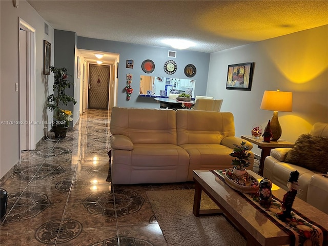 living room with a textured ceiling