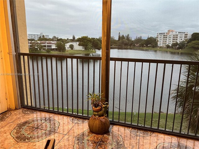 balcony featuring a water view