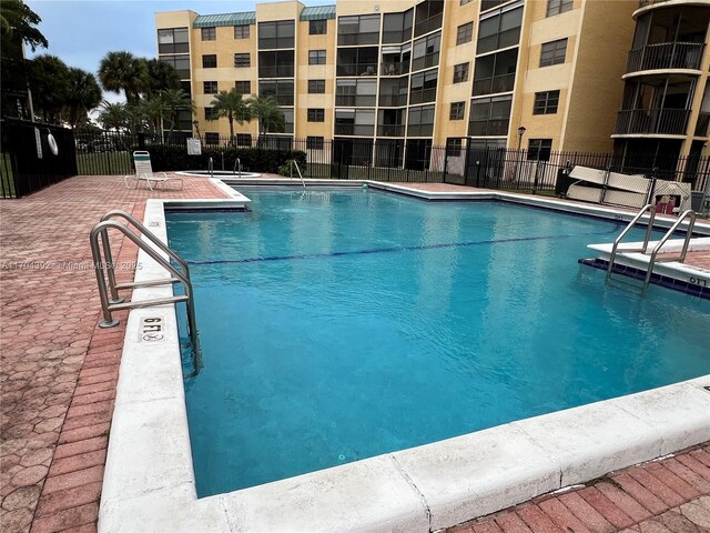 view of pool featuring a patio