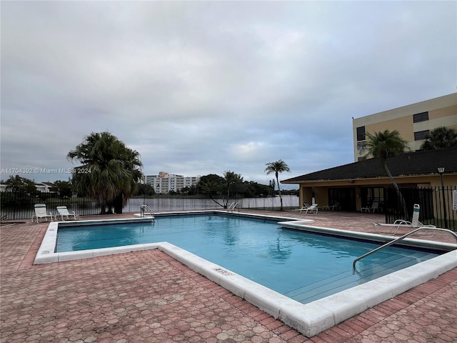 view of pool featuring a patio