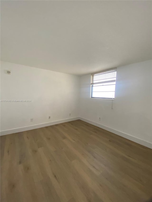 spare room featuring hardwood / wood-style floors