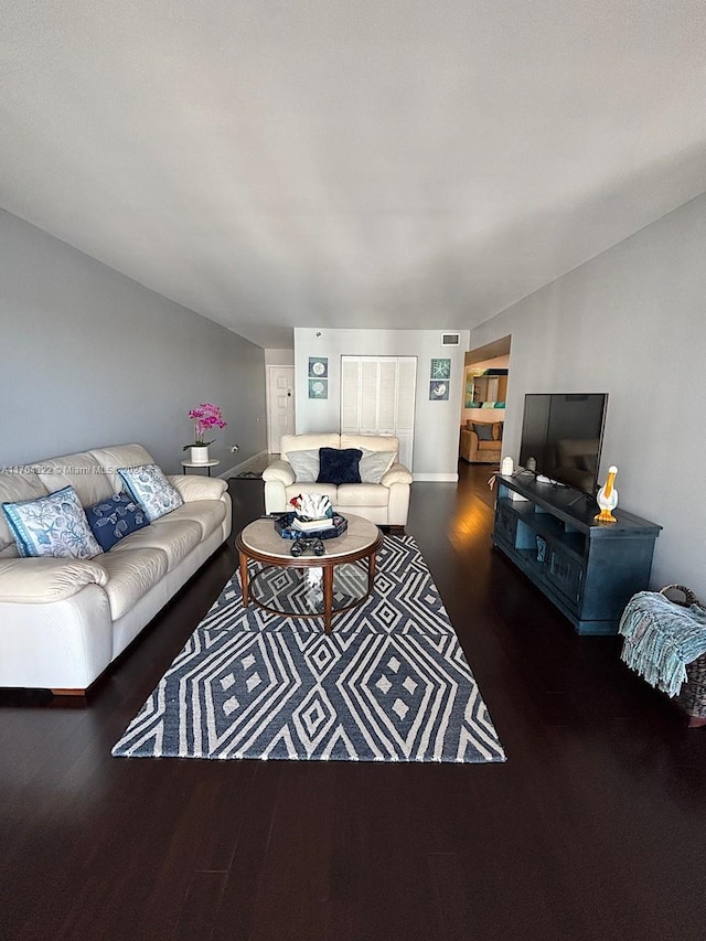 living room featuring dark hardwood / wood-style floors