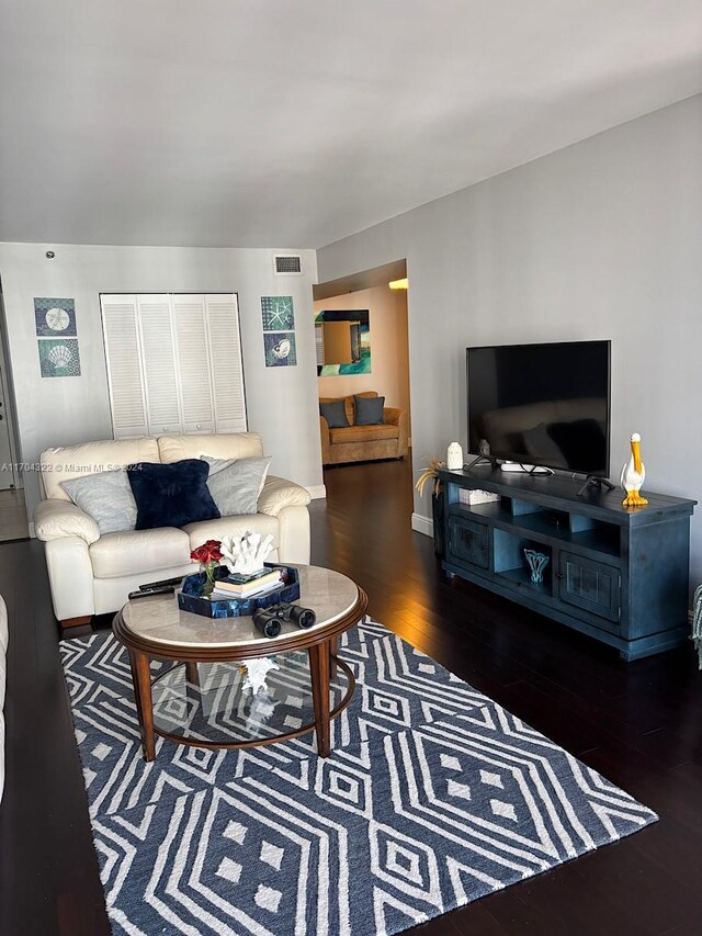 living room with dark wood-type flooring