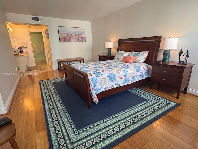 bedroom with wood-type flooring