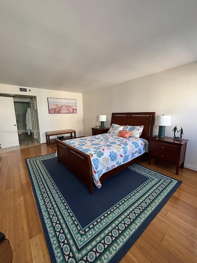 bedroom featuring wood-type flooring