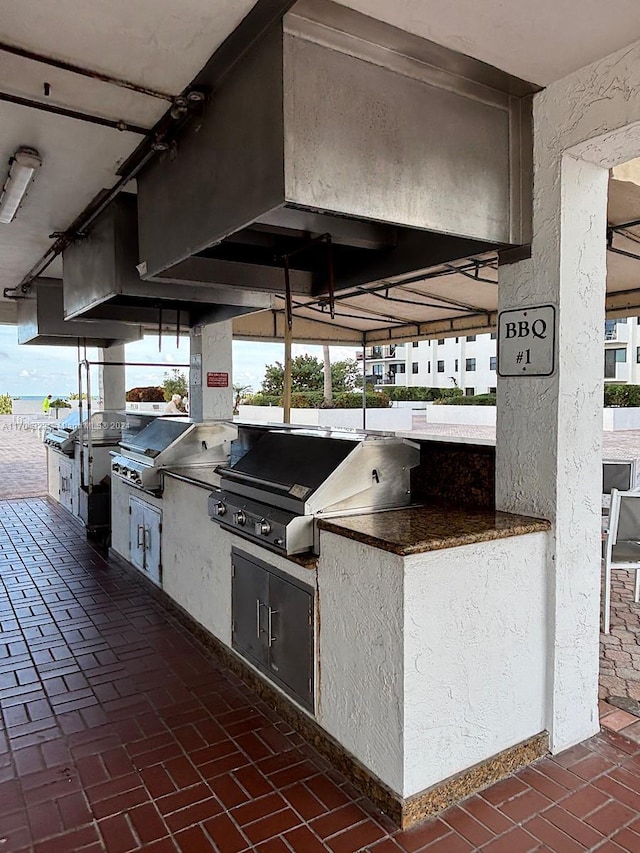 view of patio / terrace with an outdoor kitchen and a grill