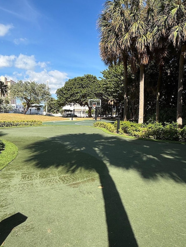 view of property's community featuring basketball court