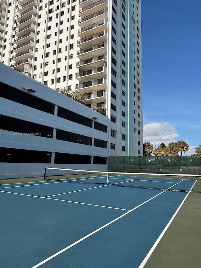 view of tennis court featuring basketball court