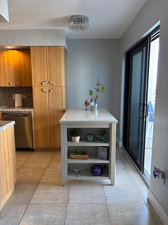 kitchen with dishwasher, tasteful backsplash, and light tile patterned flooring