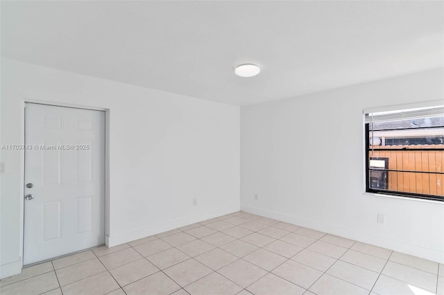 empty room with light tile patterned floors