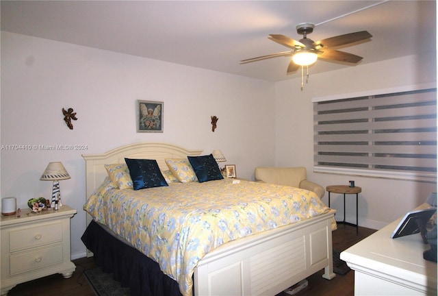 bedroom featuring dark hardwood / wood-style flooring and ceiling fan