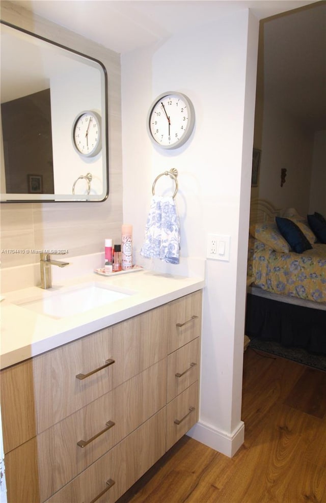 bathroom featuring vanity and wood-type flooring