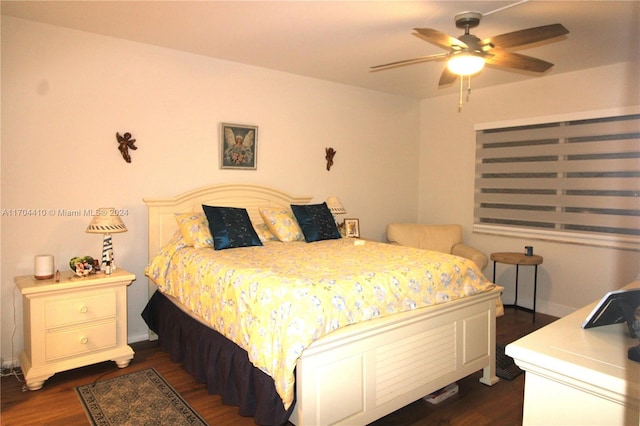 bedroom featuring ceiling fan and dark hardwood / wood-style flooring