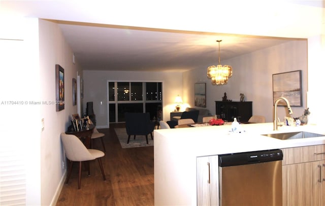 kitchen with dark hardwood / wood-style flooring, sink, a notable chandelier, dishwasher, and hanging light fixtures