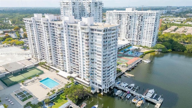 birds eye view of property with a water view