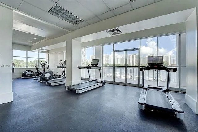 workout area featuring a drop ceiling