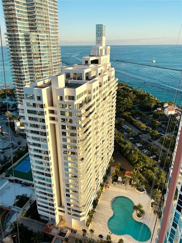 birds eye view of property with a water view