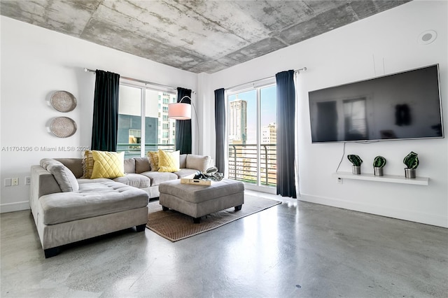 living room featuring concrete flooring