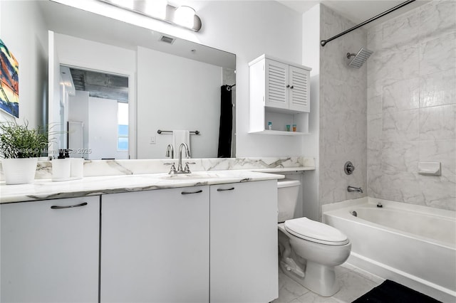 full bathroom with toilet, tiled shower / bath, and vanity