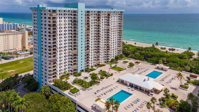 bird's eye view with a view of the beach and a water view