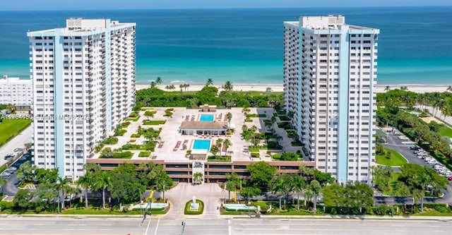 aerial view featuring a view of the beach and a water view