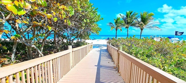 view of property's community featuring a view of the beach and a water view