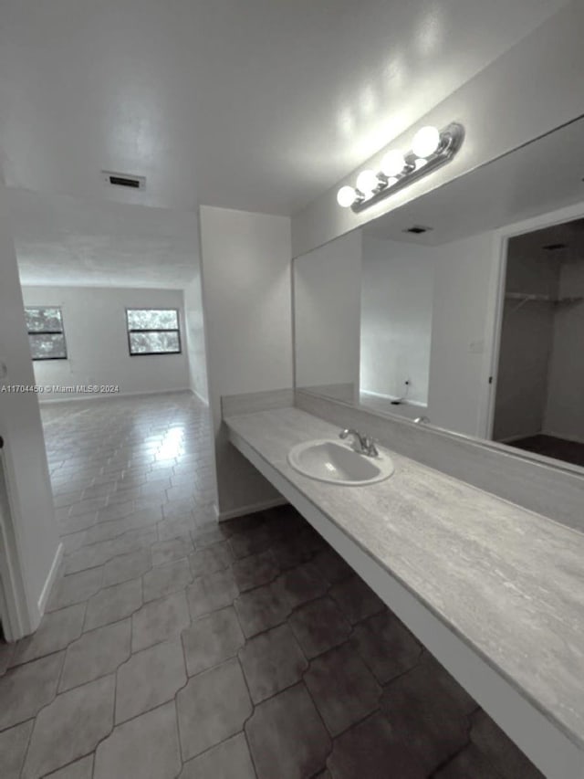 1201 S Ocean Dr Unit 206S, Hollywood, FL 33019 - bathroom with vanity and tile patterned floors