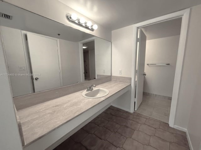 1201 S Ocean Dr Unit 206S, Hollywood, FL 33019 - bathroom featuring tile patterned floors and vanity