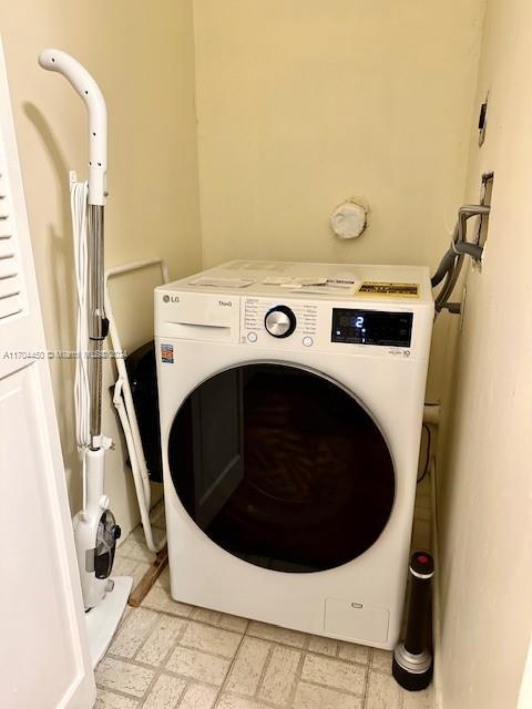 laundry room featuring washer / dryer