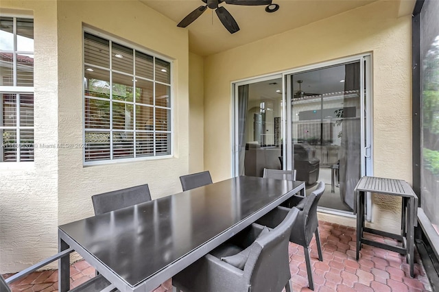 exterior space with ceiling fan