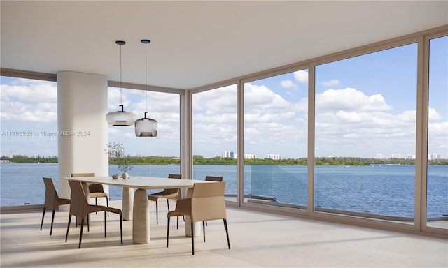 sunroom / solarium with a water view