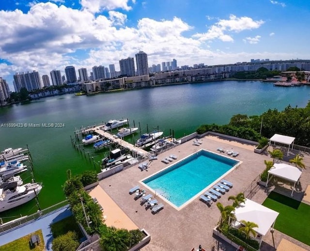 birds eye view of property with a water view