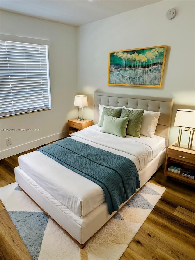 bedroom featuring hardwood / wood-style floors